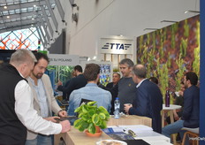 Nicely busy at the TTA booth, Geert Maris about their new CuttingEdge sticking machine for planting rooted and unrooted cuttings.